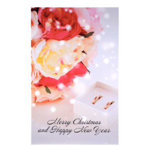 A card with flowers and a box of chocolates.