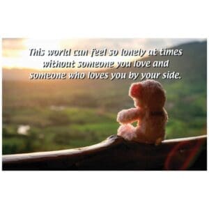 A teddy bear sitting on top of a tree branch.