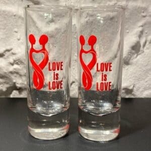Two glasses with the words love is love on them.