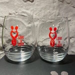 Two glasses with a mickey mouse design on them.