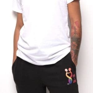 A person wearing black shorts and white shirt