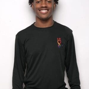 A man in black shirt smiling for the camera.