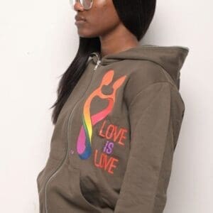 A woman wearing glasses and a hoodie.