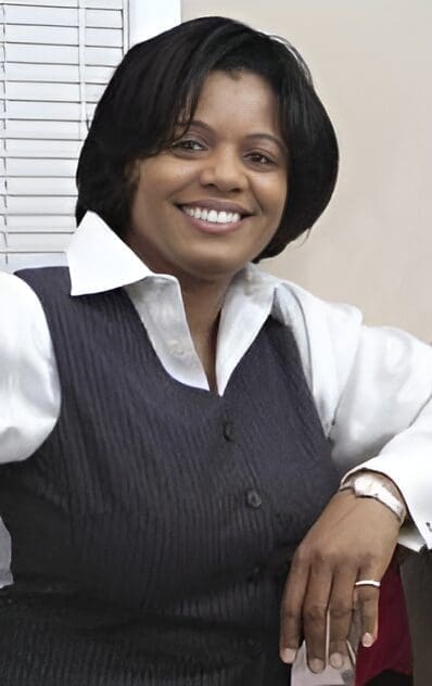 Marva, owner of ShopLoveIsLove Boutique, smiling in her professional headshot.